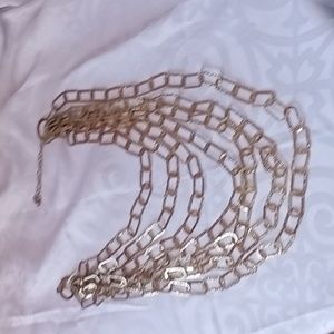 RJ Graziano 7 strand gold link cascade necklace.